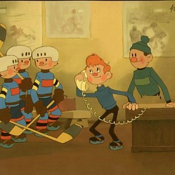 Хоккеисты и тренер у телефона